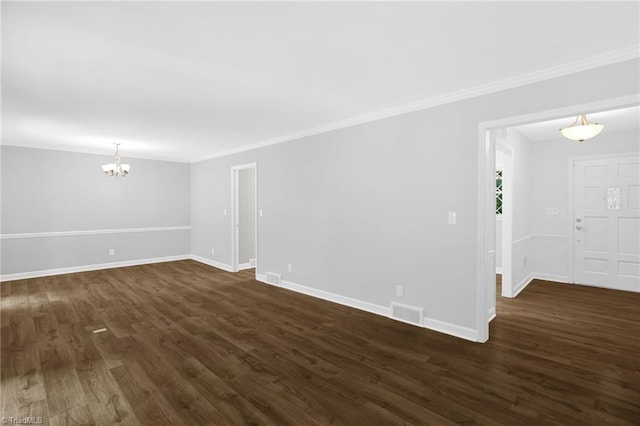 2665 Kecoughtan Rd, Pfafftown, NC 27040 - spare room with a chandelier, dark wood finished floors, ornamental molding, and baseboards