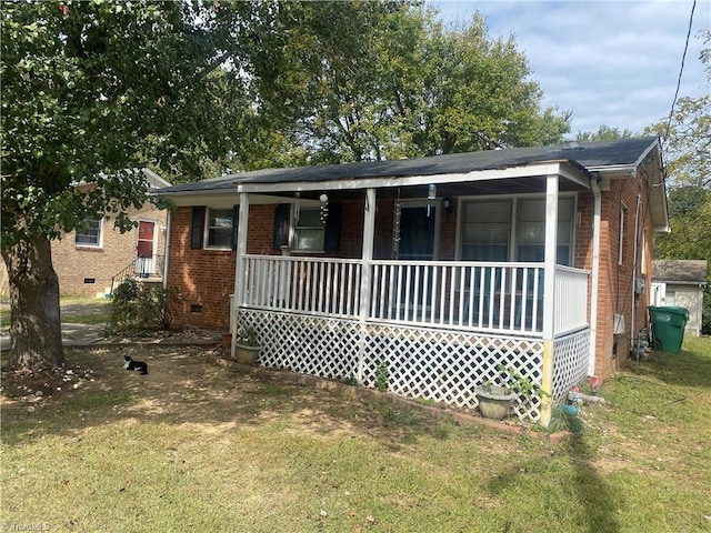 view of front of house featuring a front lawn and a porch