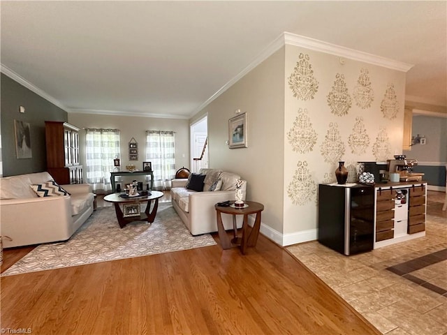 living room with beverage cooler, light wood-type flooring, and crown molding