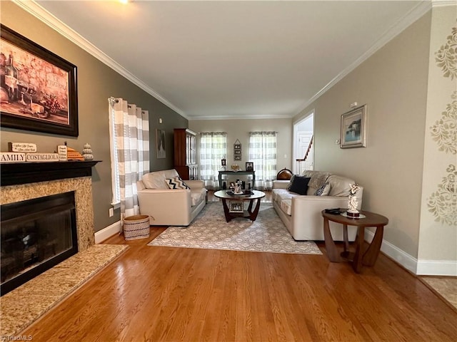 living room featuring ornamental molding and hardwood / wood-style flooring