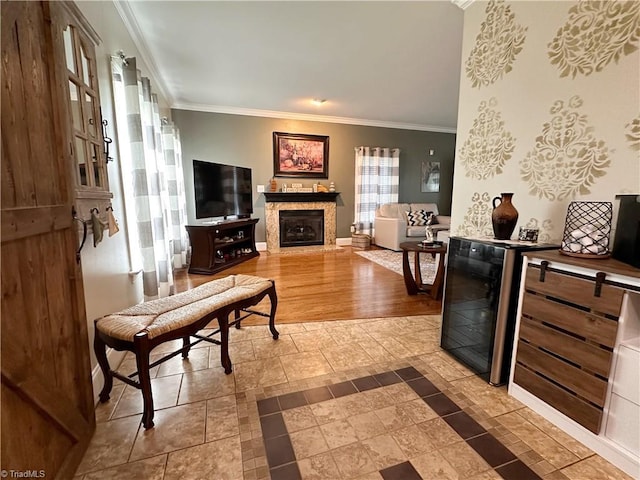 living room with beverage cooler, crown molding, and wood-type flooring