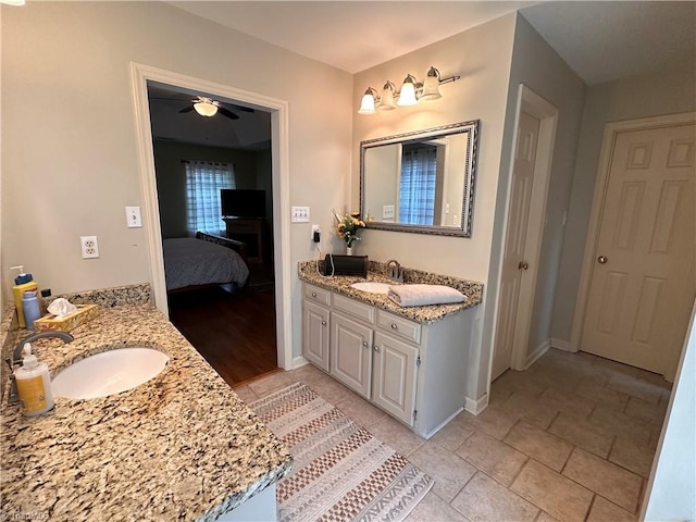 bathroom with ceiling fan and vanity