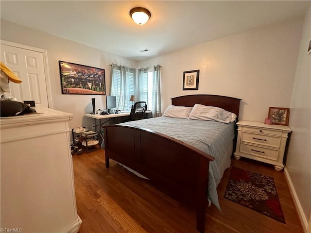 bedroom with hardwood / wood-style floors