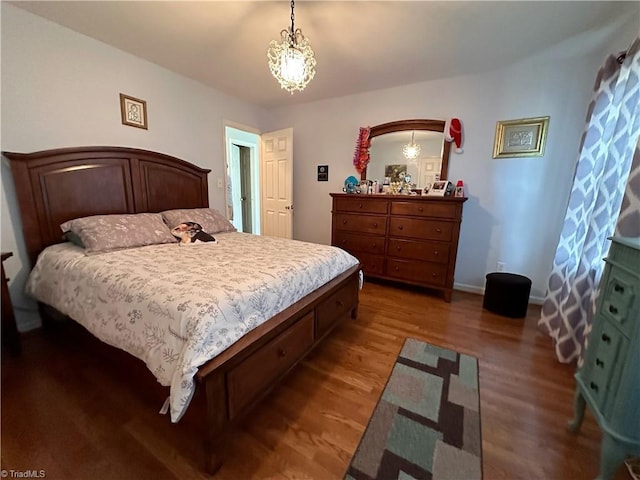 bedroom featuring dark hardwood / wood-style flooring