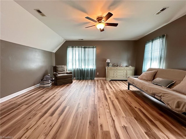 unfurnished room featuring ceiling fan, light wood-type flooring, and vaulted ceiling