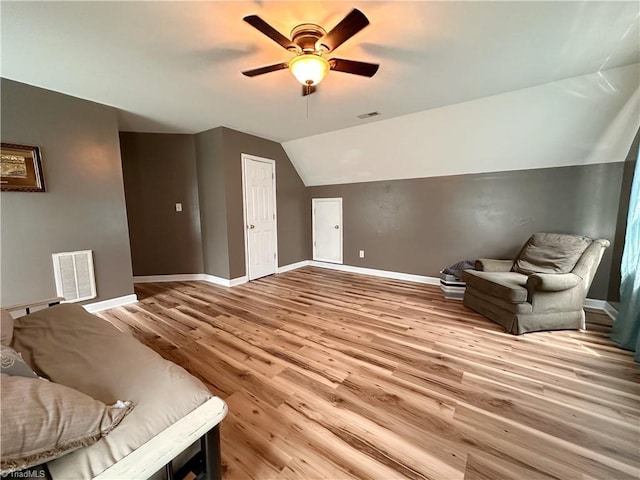 interior space featuring lofted ceiling, ceiling fan, and light hardwood / wood-style flooring