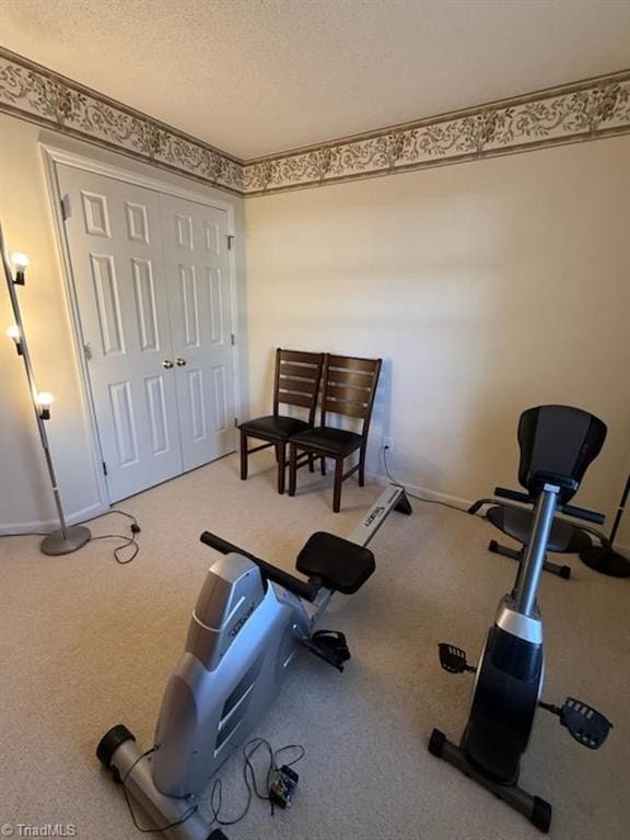 exercise area with a textured ceiling