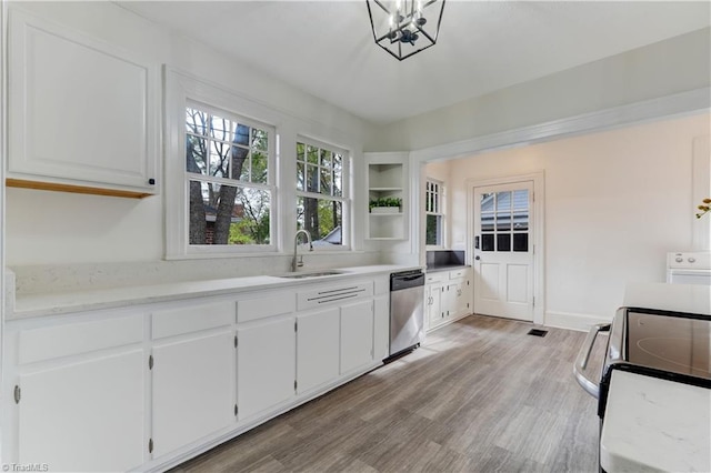 kitchen featuring white cabinets, light hardwood / wood-style floors, sink, and stainless steel appliances