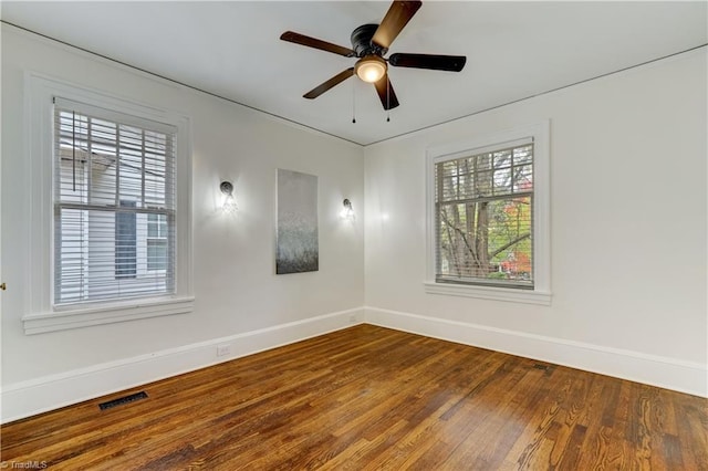 empty room featuring ceiling fan and hardwood / wood-style flooring