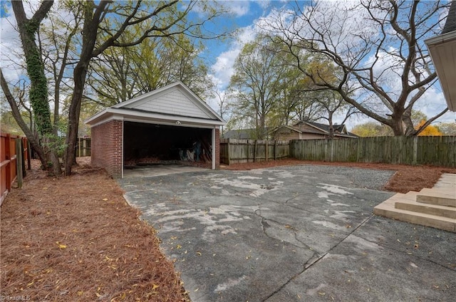 exterior space with a garage and an outdoor structure