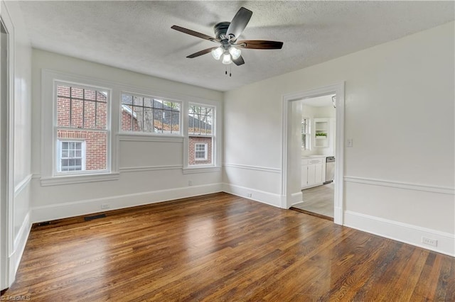 unfurnished room with a textured ceiling, hardwood / wood-style flooring, and ceiling fan