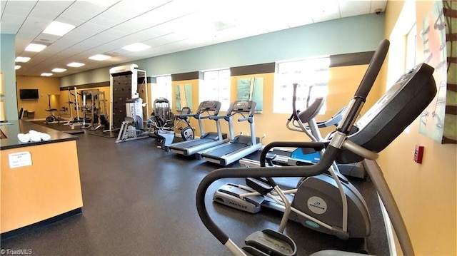 workout area featuring a drop ceiling