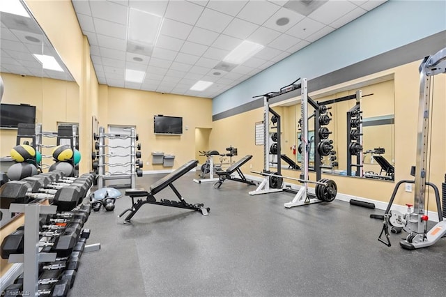 exercise room with a paneled ceiling