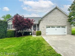 6416 Starlette Ln, Trinity, NC 27370 - view of front of home featuring driveway, an attached garage, and a front yard