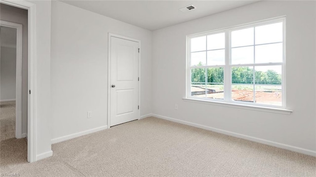 1529 String Dr, Winston-Salem, NC 27107 - empty room featuring light carpet and baseboards