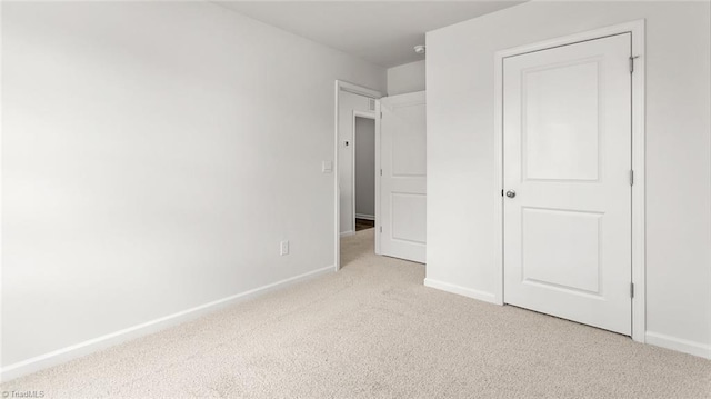1529 String Dr, Winston-Salem, NC 27107 - unfurnished bedroom with light carpet and baseboards