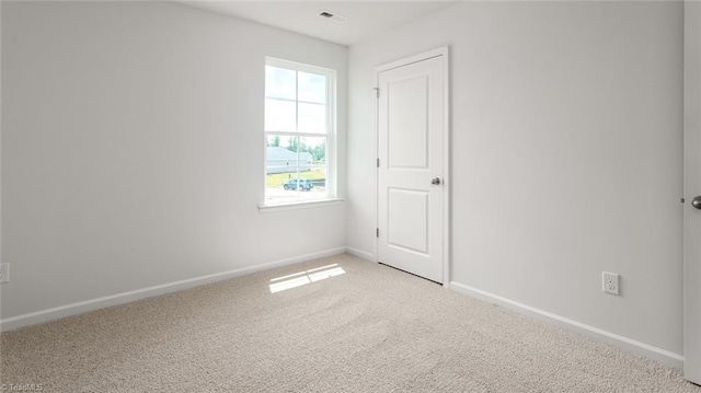 1529 String Dr, Winston-Salem, NC 27107 - unfurnished room featuring baseboards and light colored carpet