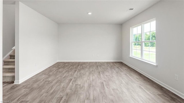 1529 String Dr, Winston-Salem, NC 27107 - unfurnished room featuring wood finished floors, baseboards, stairway, and recessed lighting