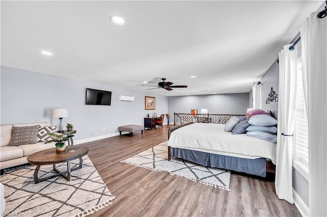 bedroom with a ceiling fan, recessed lighting, wood finished floors, and baseboards