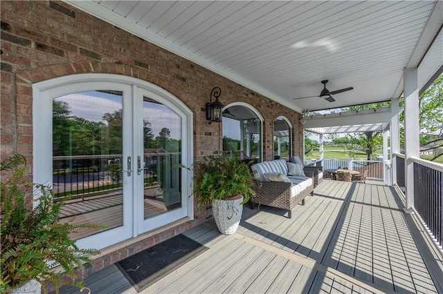 wooden deck with french doors and ceiling fan