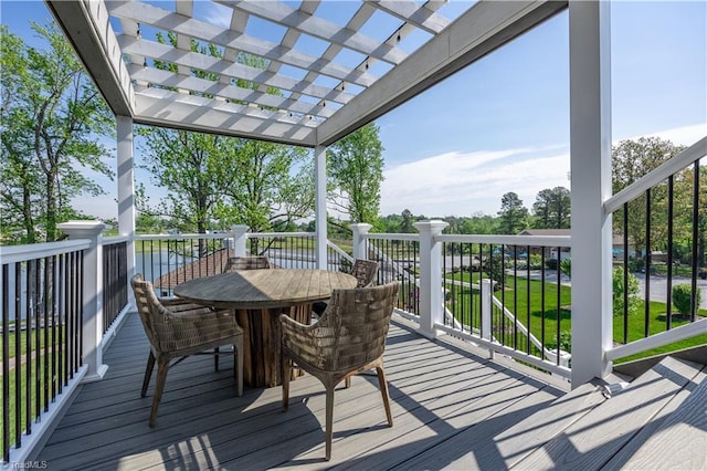 wooden terrace featuring outdoor dining area and a pergola