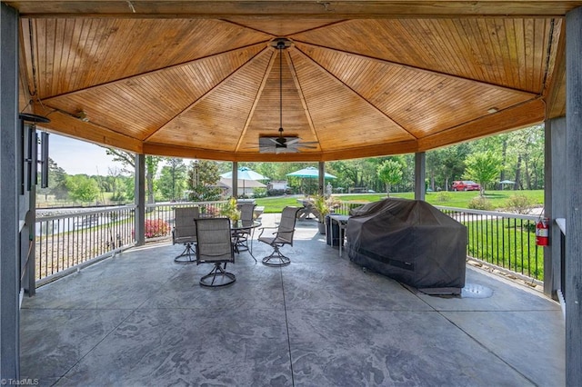 view of patio / terrace featuring a gazebo, outdoor dining area, and grilling area