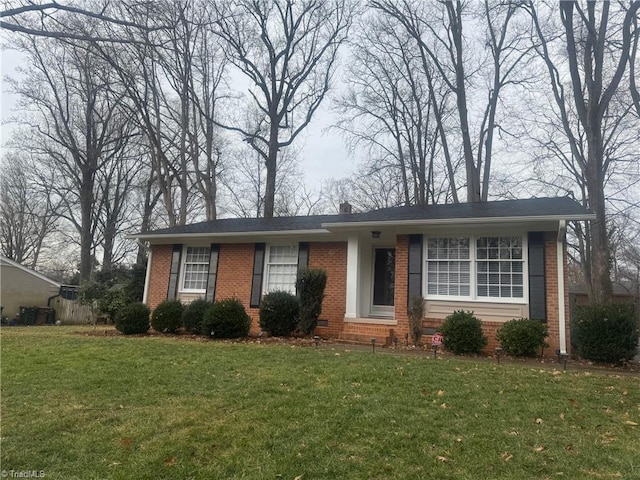 ranch-style house featuring a front lawn