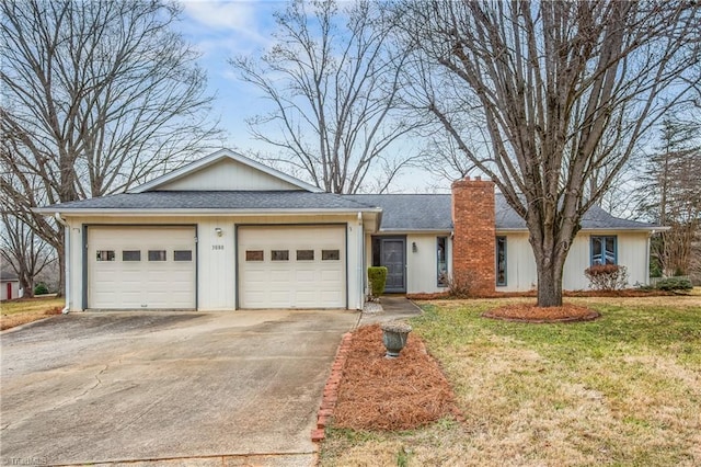 ranch-style home with a garage and a front yard