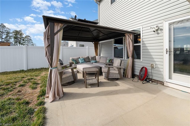 view of patio featuring a gazebo and an outdoor living space