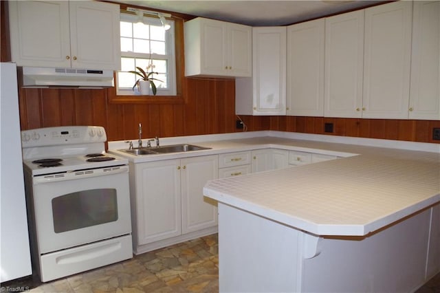 kitchen with light tile patterned flooring, white cabinetry, sink, white electric range, and wall chimney exhaust hood