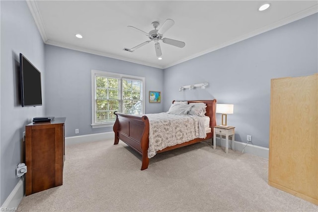 carpeted bedroom with crown molding and ceiling fan