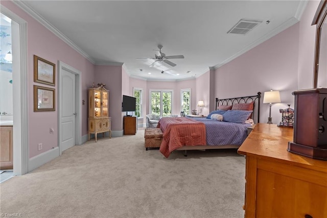 carpeted bedroom with crown molding, ceiling fan, and ensuite bath