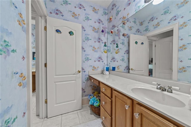 bathroom with tile patterned floors and vanity