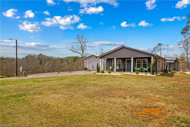 1595 Cheatham Ford Rd, Hiddenite, NC 28636 - back of house with a lawn