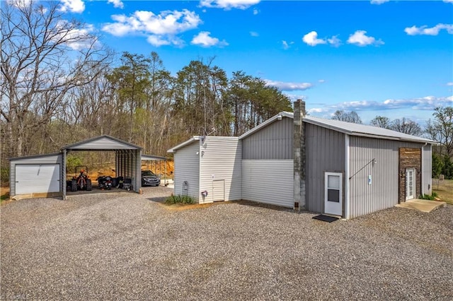 1595 Cheatham Ford Rd, Hiddenite, NC 28636 - garage with a detached carport and gravel driveway