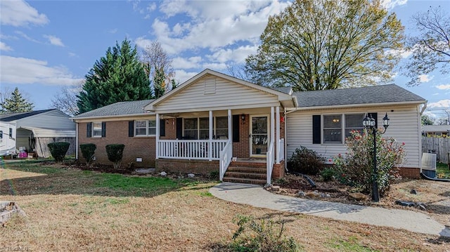 view of front of home featuring covered porch and a front yard