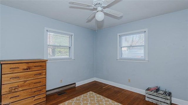 spare room with ceiling fan and dark hardwood / wood-style floors