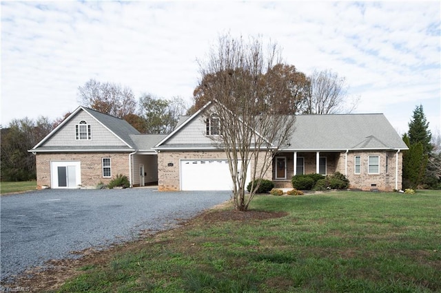 view of front of house with a garage and a front yard