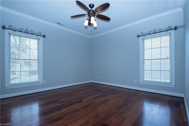 unfurnished room with crown molding, plenty of natural light, dark hardwood / wood-style floors, and ceiling fan