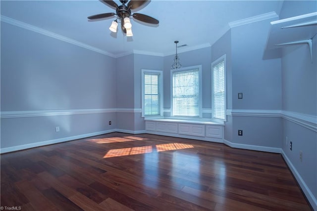 unfurnished room with crown molding, dark wood-type flooring, and ceiling fan with notable chandelier