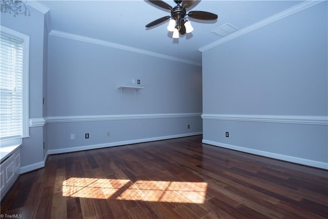 spare room with ceiling fan, crown molding, and dark wood-type flooring