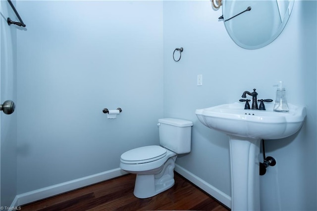 bathroom featuring toilet and hardwood / wood-style floors