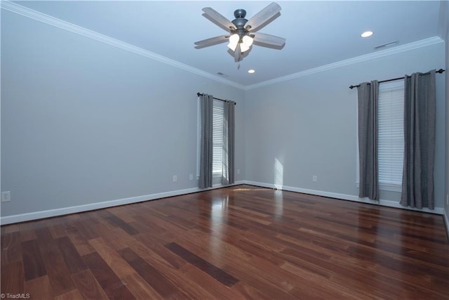 empty room featuring dark hardwood / wood-style flooring, ceiling fan, and ornamental molding