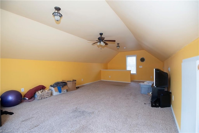 additional living space with ceiling fan, lofted ceiling, and carpet