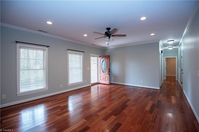 unfurnished room with ceiling fan, ornamental molding, and dark wood-type flooring