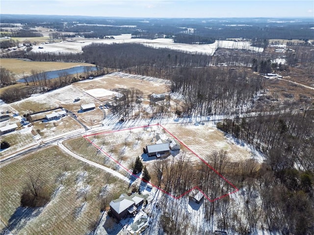 snowy aerial view with a rural view