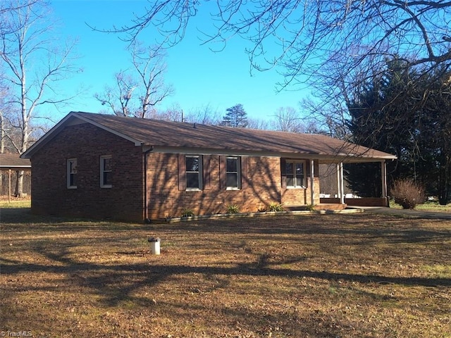 ranch-style home with a porch and a front yard