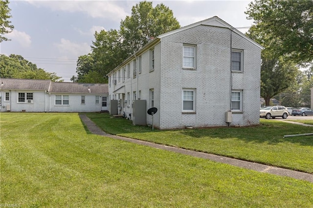 back of house with a yard