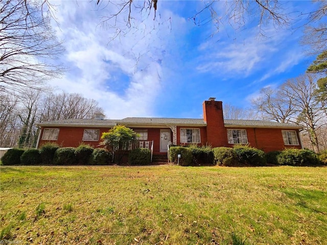 3015 S NC Highway 87, Graham, NC 27253 - single story home with a chimney, brick siding, and a front yard