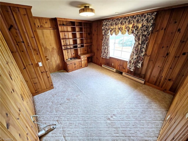 3015 S NC Highway 87, Graham, NC 27253 - empty room with light carpet, wood walls, baseboards, built in features, and a baseboard radiator